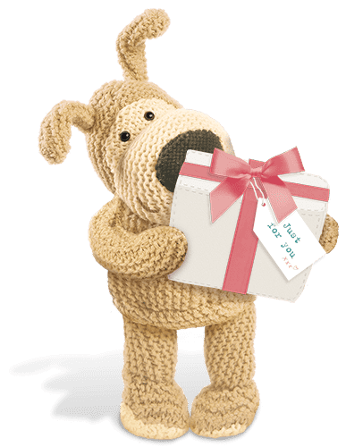 Boofle holding a wrapped present with a pink bow